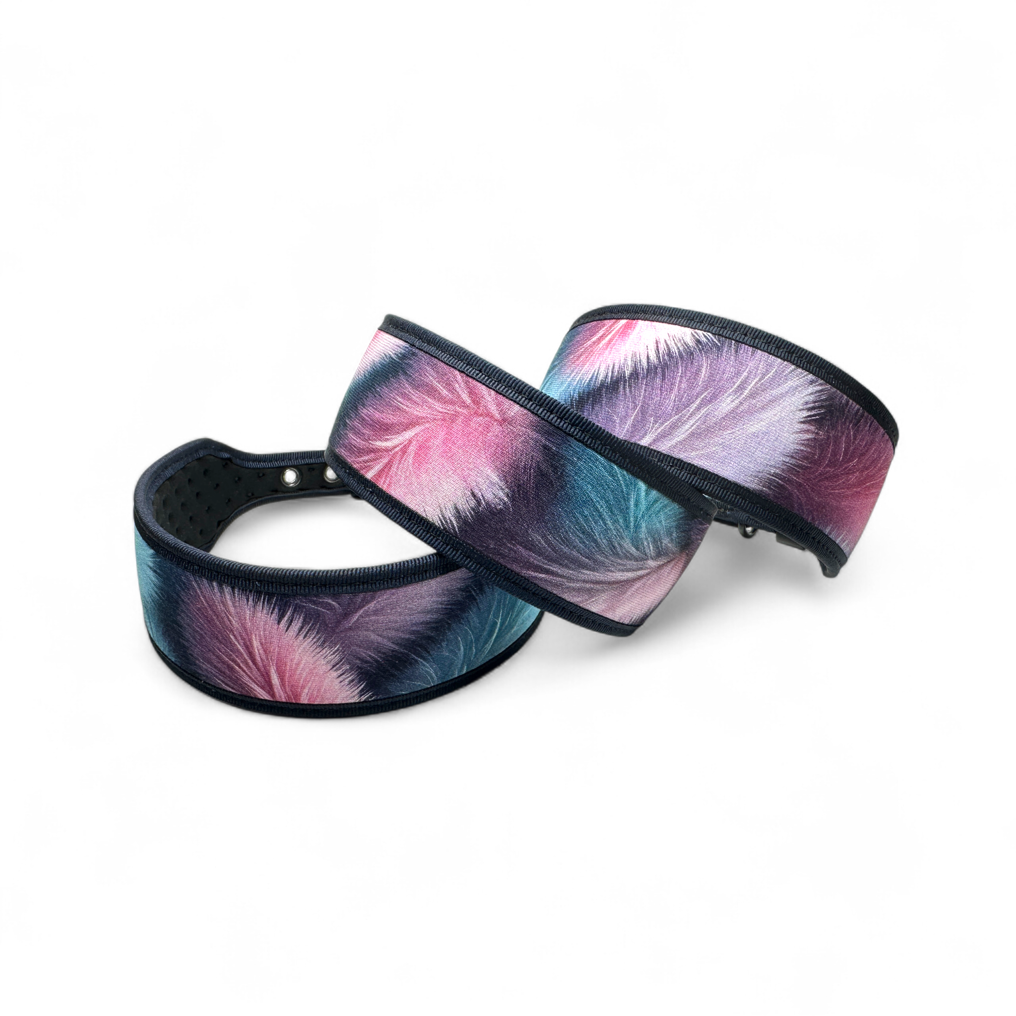 Two colorful feather-patterned headbands on a white background